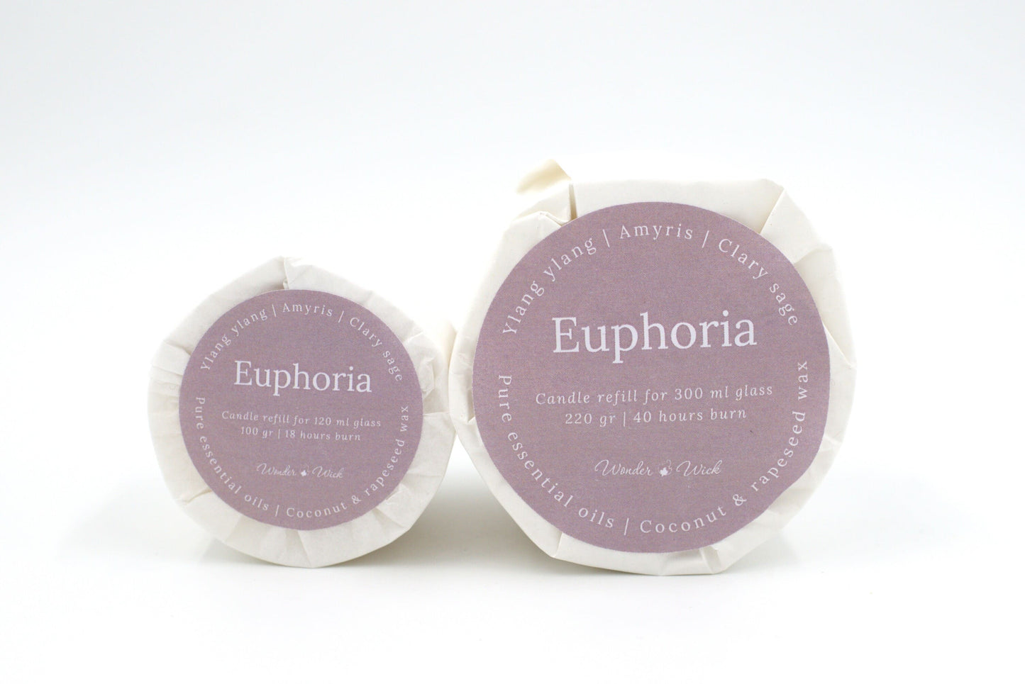 Euphoria candle refills in two sizes: 120 ml and 300 ml options, labeled with ylang ylang, clary sage, and amyris essential oils, wrapped in sustainable glassine paper
