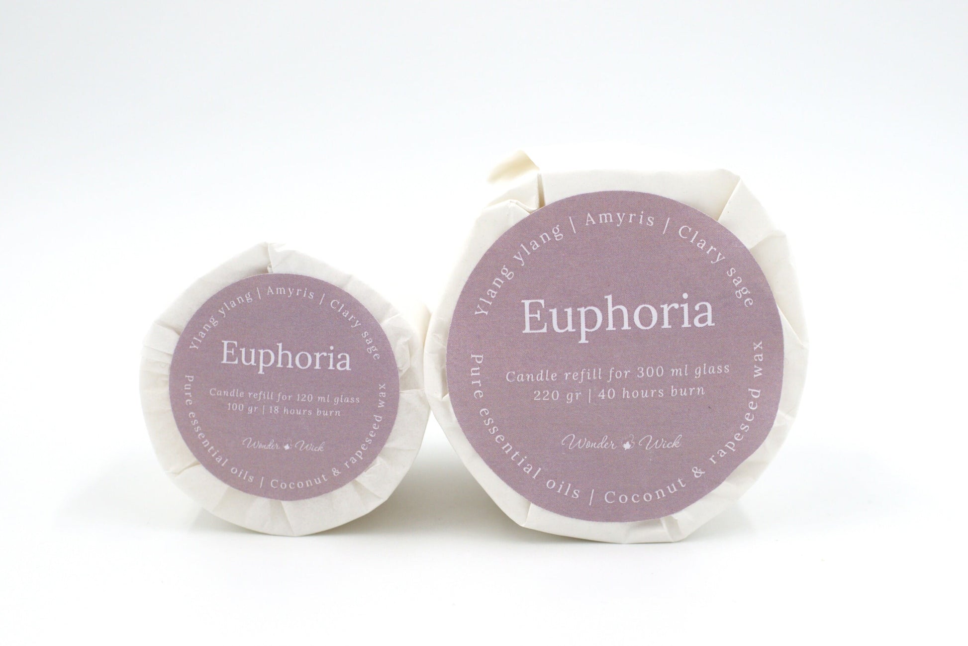 Euphoria candle refills in two sizes: 120 ml and 300 ml options, labeled with ylang ylang, clary sage, and amyris essential oils, wrapped in sustainable glassine paper
