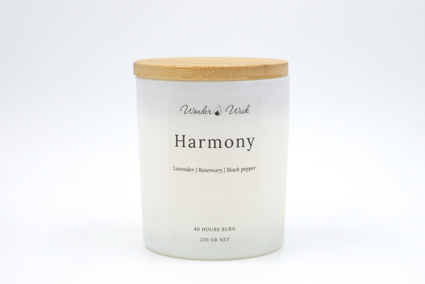A 40-hour burn Harmony relaxing candle with the bamboo lid on, emphasizing its sustainable design and relaxing scent blend of lavender, rosemary, and black pepper. Perfect for moments of calm and de-stressing.