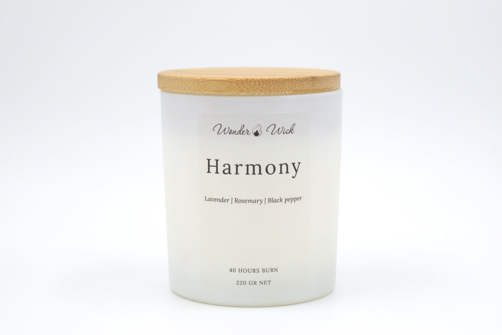 A 40-hour burn Harmony relaxing candle with the bamboo lid on, emphasizing its sustainable design and relaxing scent blend of lavender, rosemary, and black pepper. Perfect for moments of calm and de-stressing.