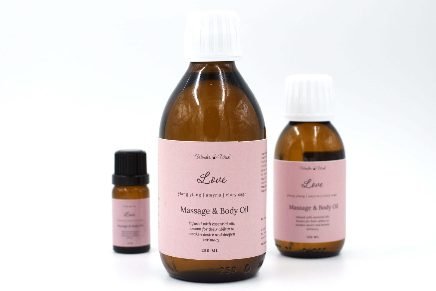 Wonder Wick's Love romantic massage oil for couples with essential oils, featuring a prominent 250 ml bottle, alongside a 100 ml bottle and a smaller sample size. Infused with ylang ylang, amyris, and clary sage essential oils, known for their ability to awaken desire an