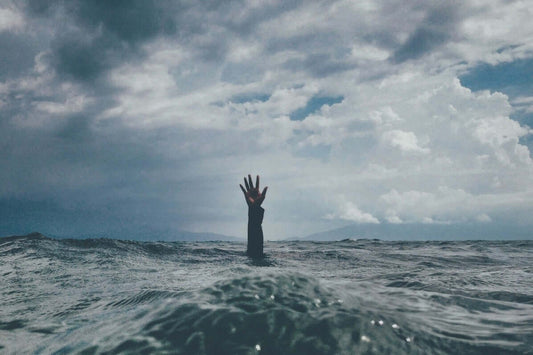 Hand coming out of the sea - Managing Stress: Effective Strategies for a Calmer Life
