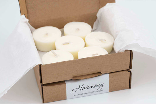 6-pack of Harmony scented tea light candles with lavender, rosemary, and black pepper, refillable and natural tealights in eco-friendly packaging.