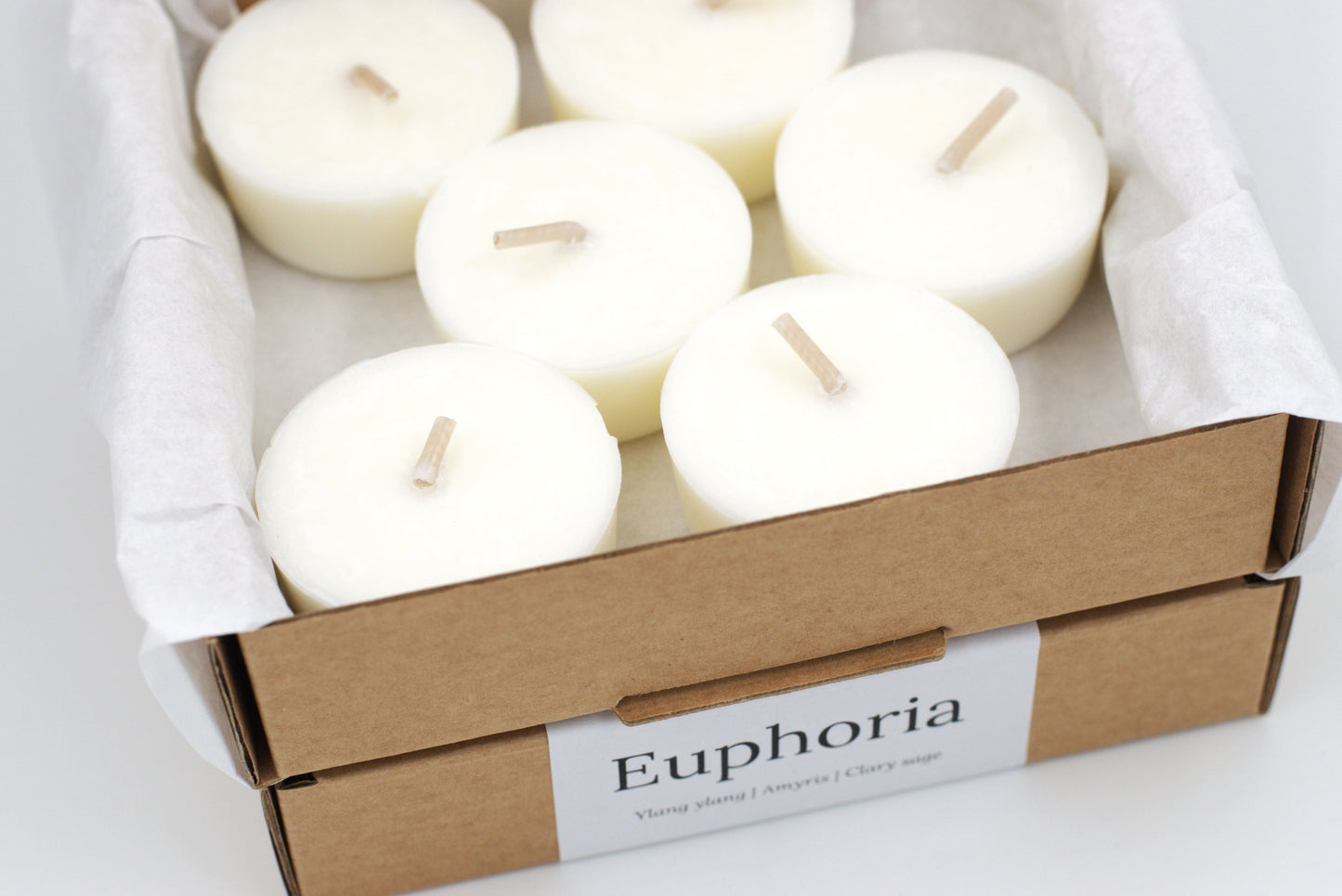 Top view of Wonder Wick's Euphoria tealight refills, pack of 6, sustainably packaged. Made with natural essential oils of ylang ylang, amyris, and clary sage.