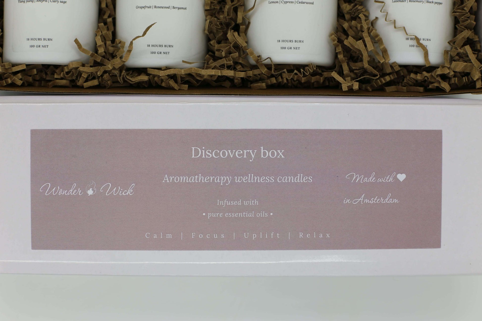 Wonder Wick discovery box label displaying 'Aromatherapy wellness candles,' 'Infused with pure essential oils,' and 'Made with love in Amsterdam.'