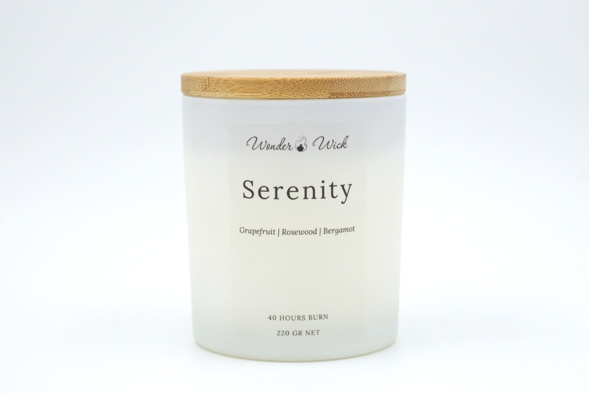 Serenity 220g candle with bamboo lid on, designed to uplift and refresh with notes of grapefruit, bergamot, and rosewood.