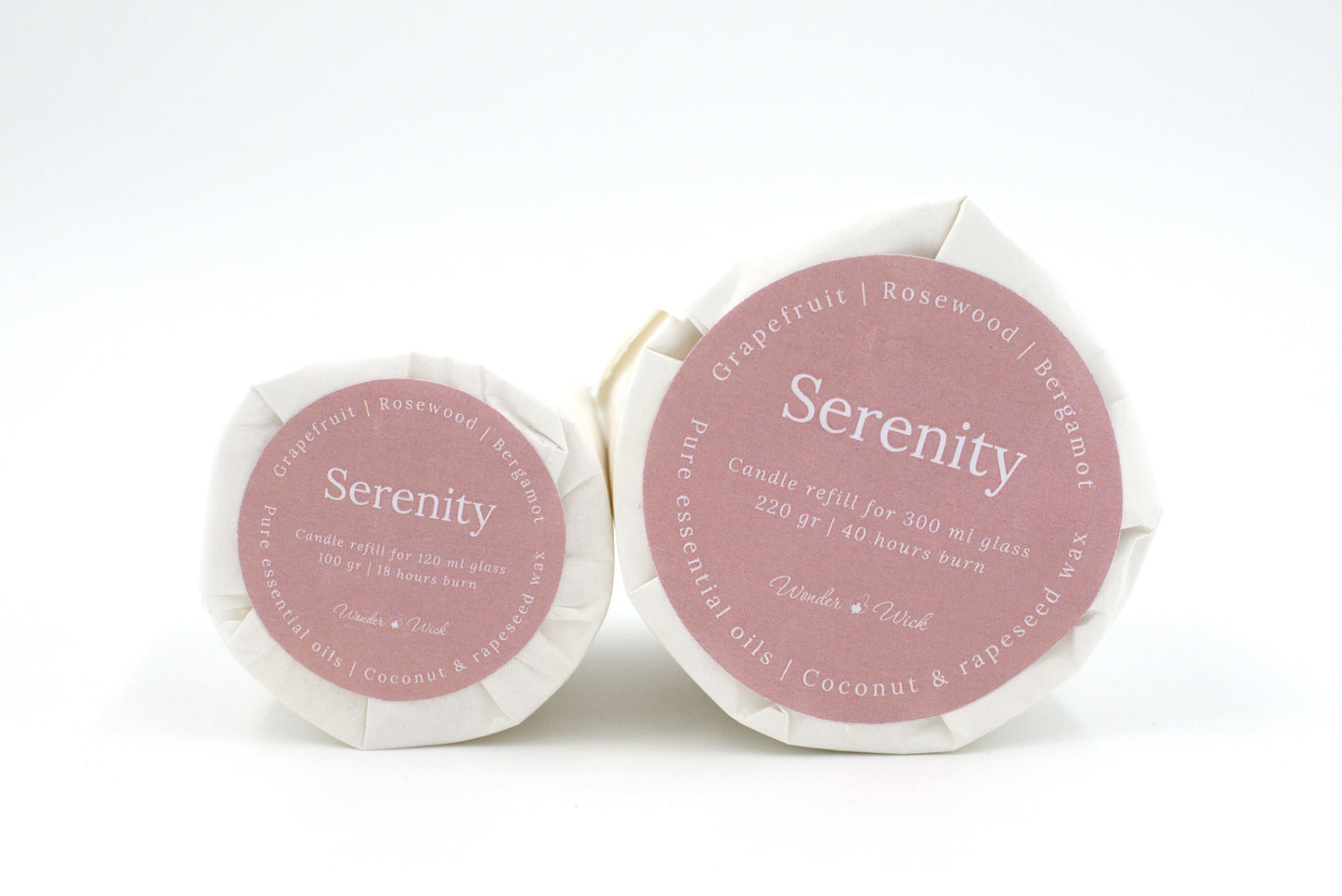 Serenity candle refills in two sizes: 120 ml and 300 ml options, labeled with grapefruit, rosewood, and bergamot essential oils, wrapped in sustainable glassine paper.